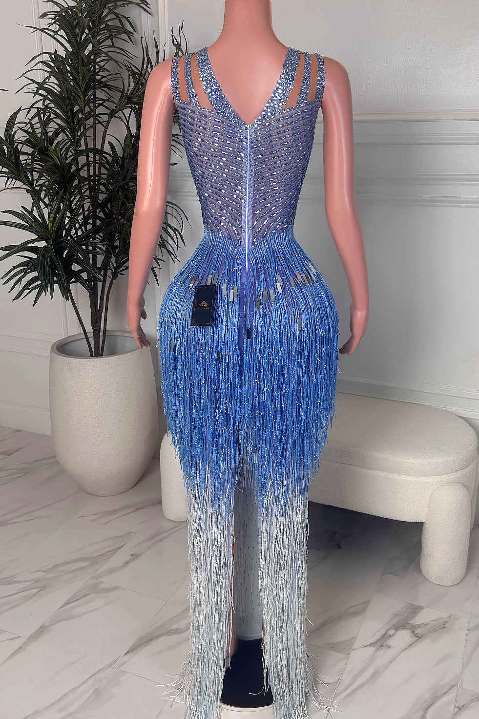 Back view of blue and silver rhinestone fringe maxi dress showing the fitted crystal bodice and long blue to silver fringe skirt