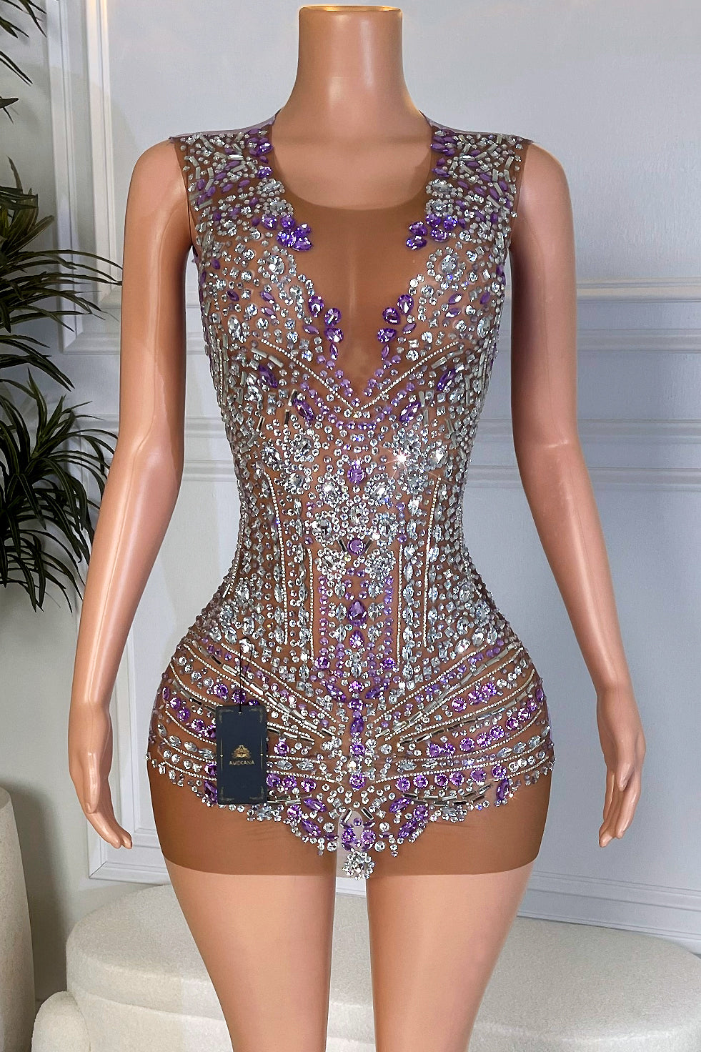 Front view of a purple rhinestone velvet birthday mini dress from Amekana, featuring a nude illusion mesh front fully covered in silver and purple crystals.