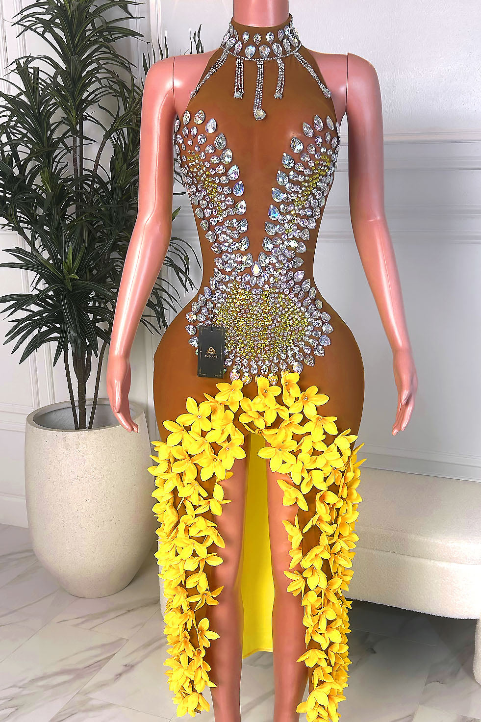 Yellow gown with crystal halter neckline, nude illusion bodice, and 3D floral slit cascade, front view.